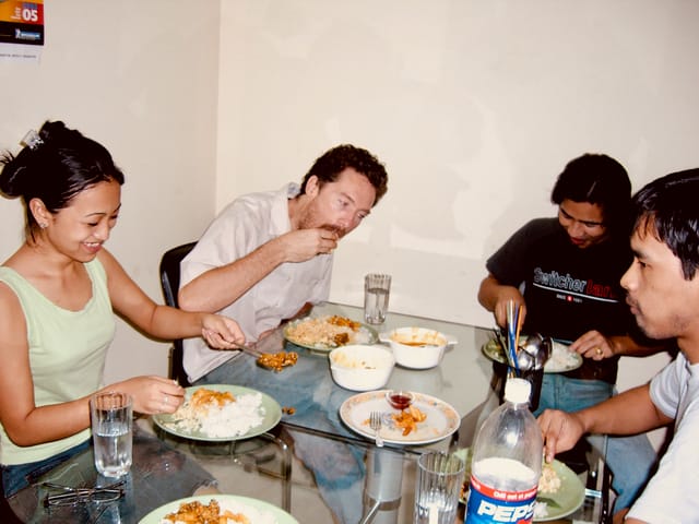 Teaching Freeman Murray to eat with his Hands